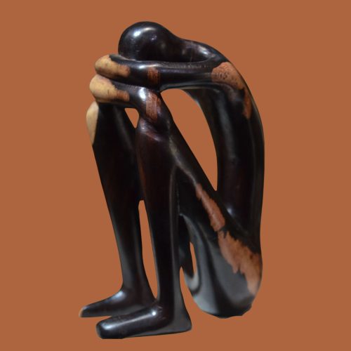 Handcrafted sculpture of a figure in deep stress, perfect for adding an evocative touch to your home or office decor.