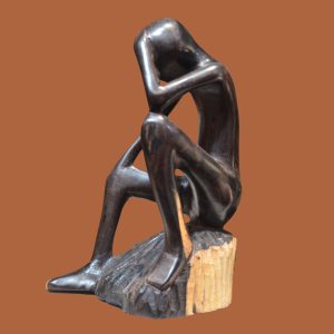 Handcrafted sculpture of a figure in deep thought, perfect for adding a contemplative touch to your home or office decor.