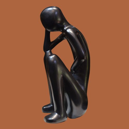 Handcrafted sculpture of a figure in deep thought, perfect for adding a contemplative touch to your home or office decor.