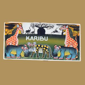 Hand-painted Tanzanian name plate featuring giraffes, hippos, and leopards with the word 'Karibu' in a lush savannah landscape.